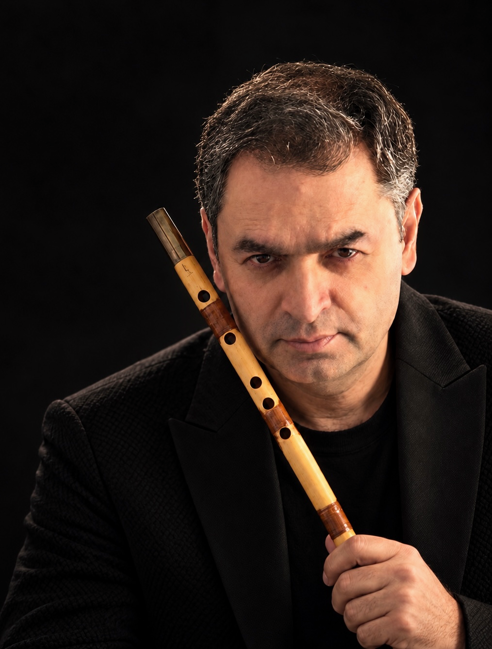 Kianoush Khalilian, Persian ney musician, composer, and educator, holding a ney