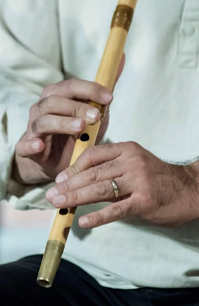 Close view of Persian ney finger placement